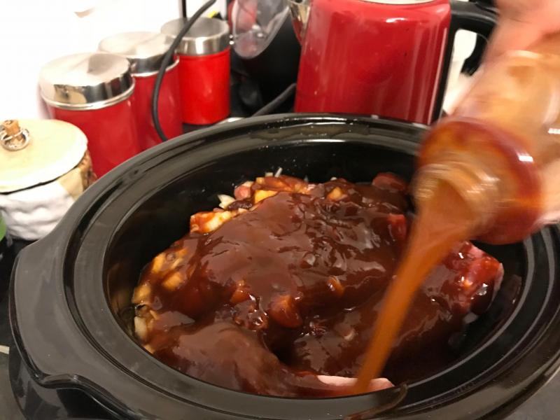 Step 2: Add a little water to the BBQ sauce bottle (about half), swish around and pour out over the ribs